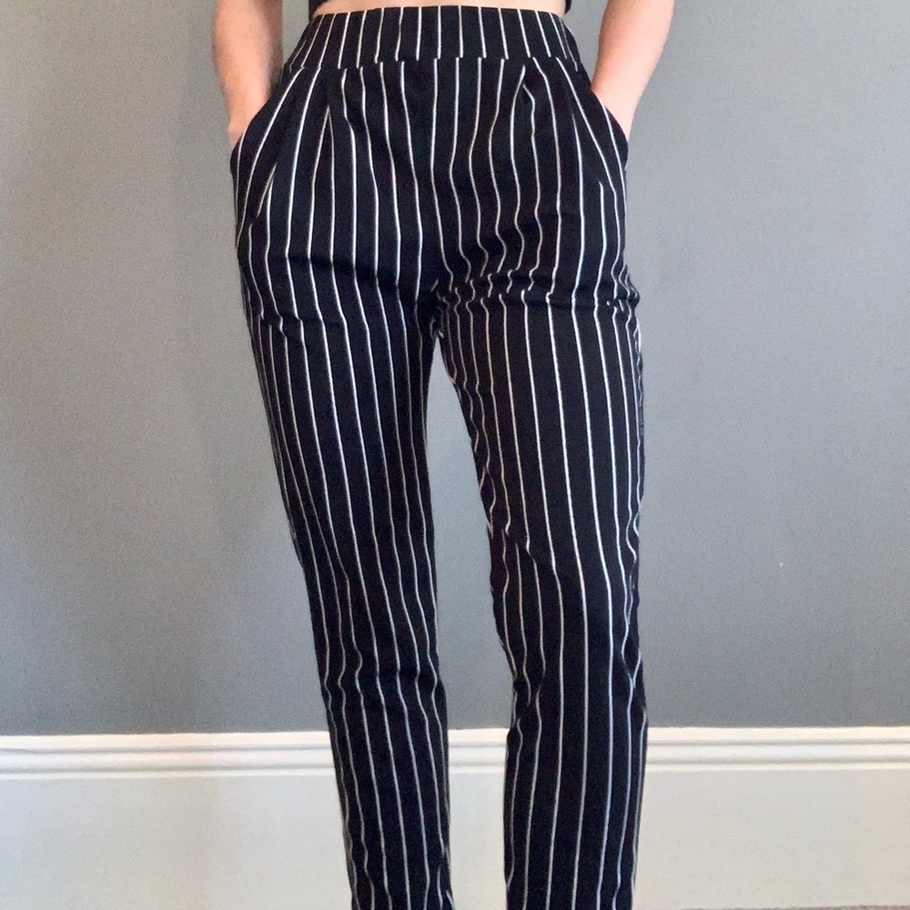 Black and white vertical stripped pants.